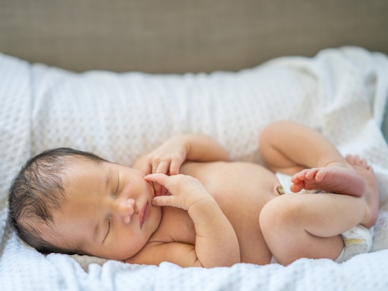 baby sleeping in bassinet