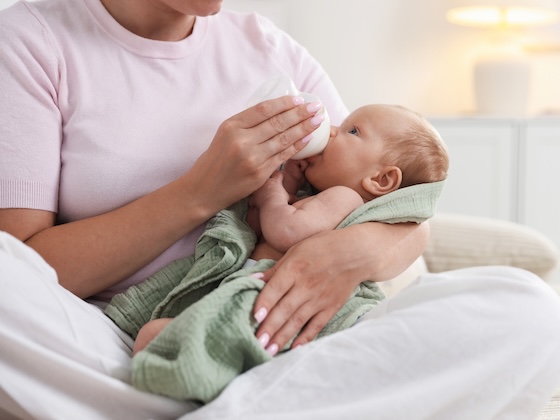 mother feeding infant